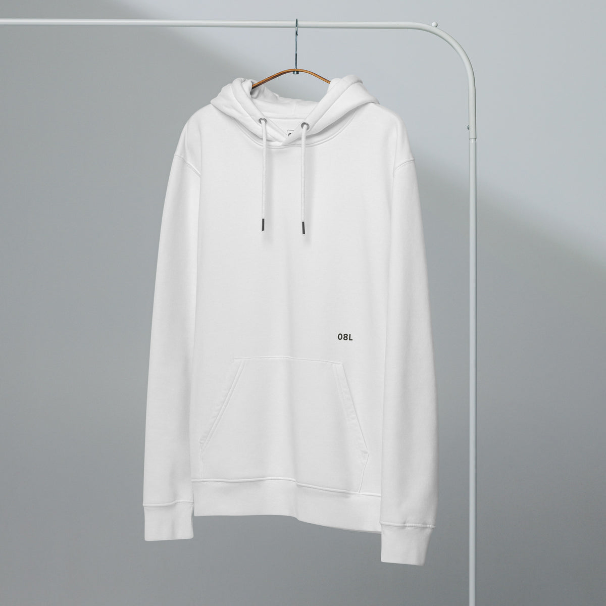 Language of Runways hoodie in white, front, on a hanger